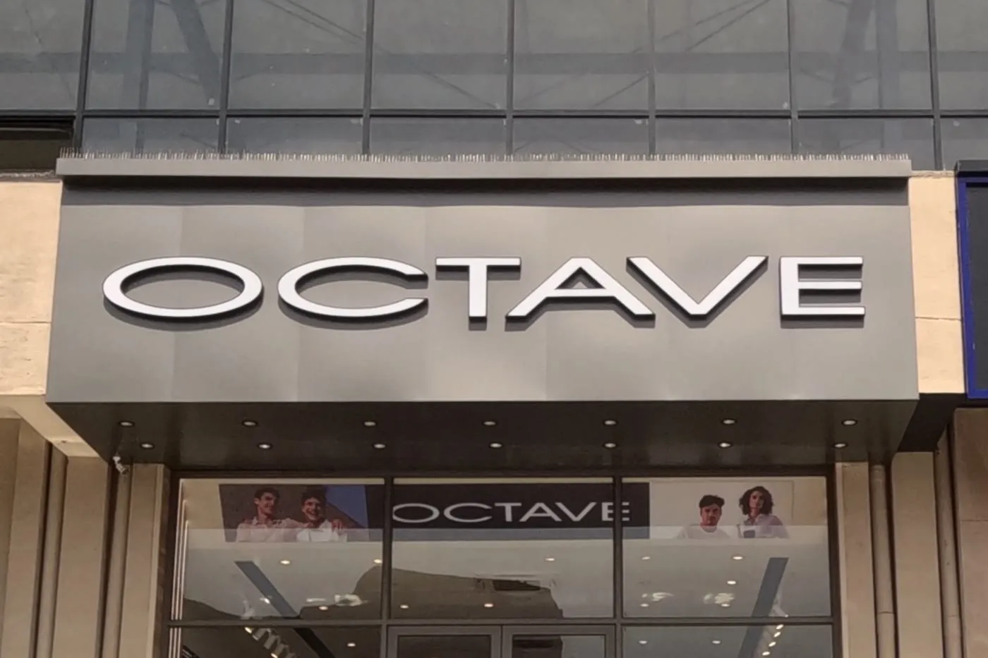 OCTAVE fascia signage above the entrance to a retail unit.