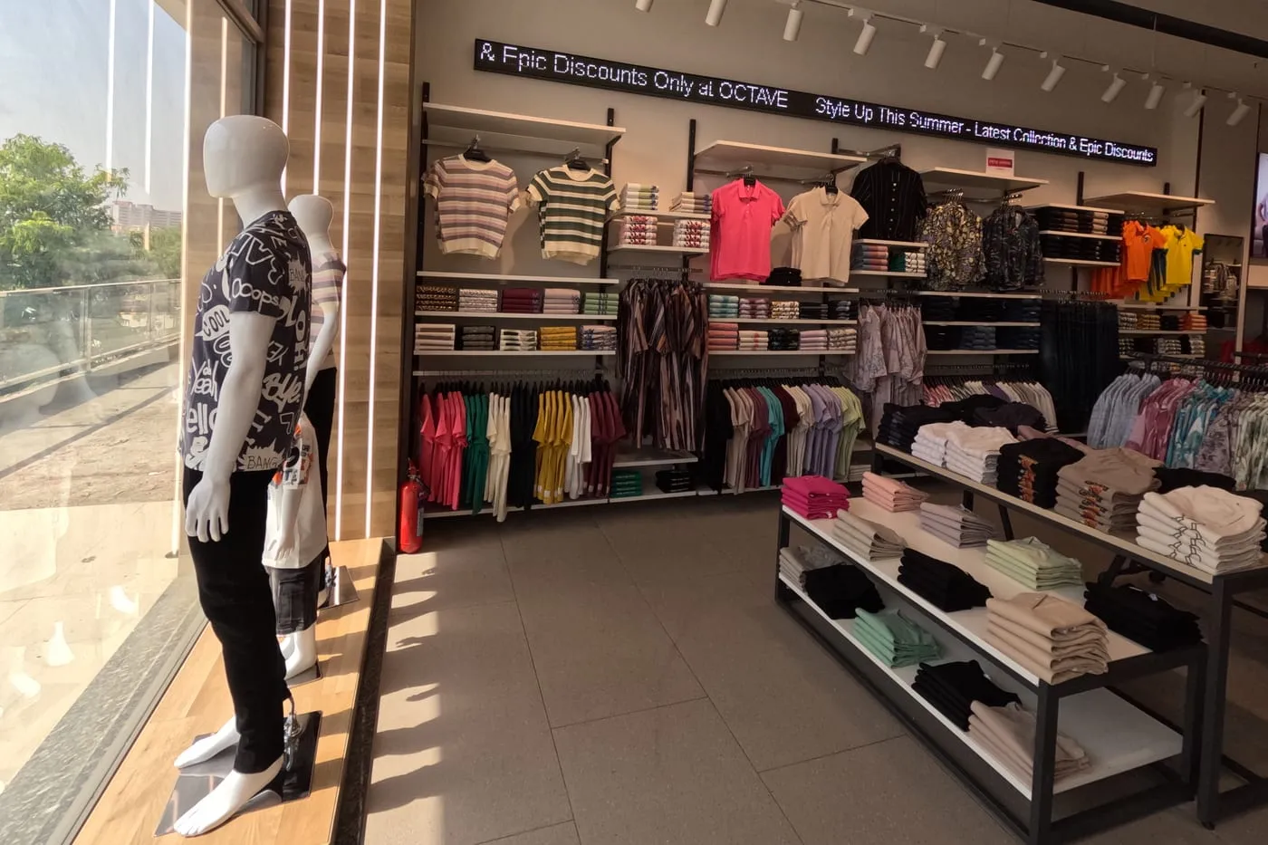 Store interior showing merchandised walls and floor fixtures across a wide sales floor.